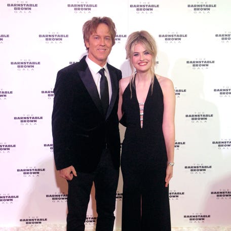 Larry Birkhead, left, and daughter, Dannielynn Birkhead, right, pose on the Barnstable Brown Derby Eve Gala red carpet on May 2, 2025.