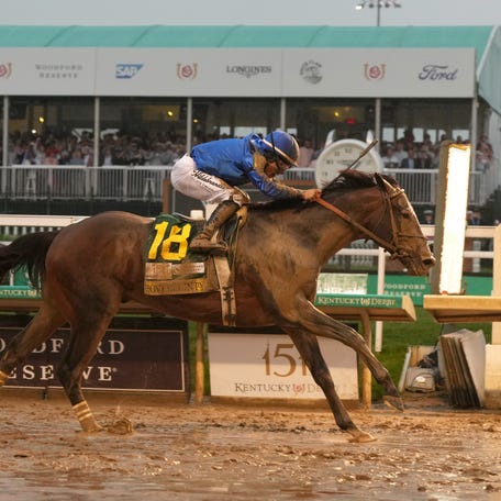 Sovereignty, ridden by jockey Junior Alvarado, crosses the finish line to win the 151st running of the Kentucky Derby.