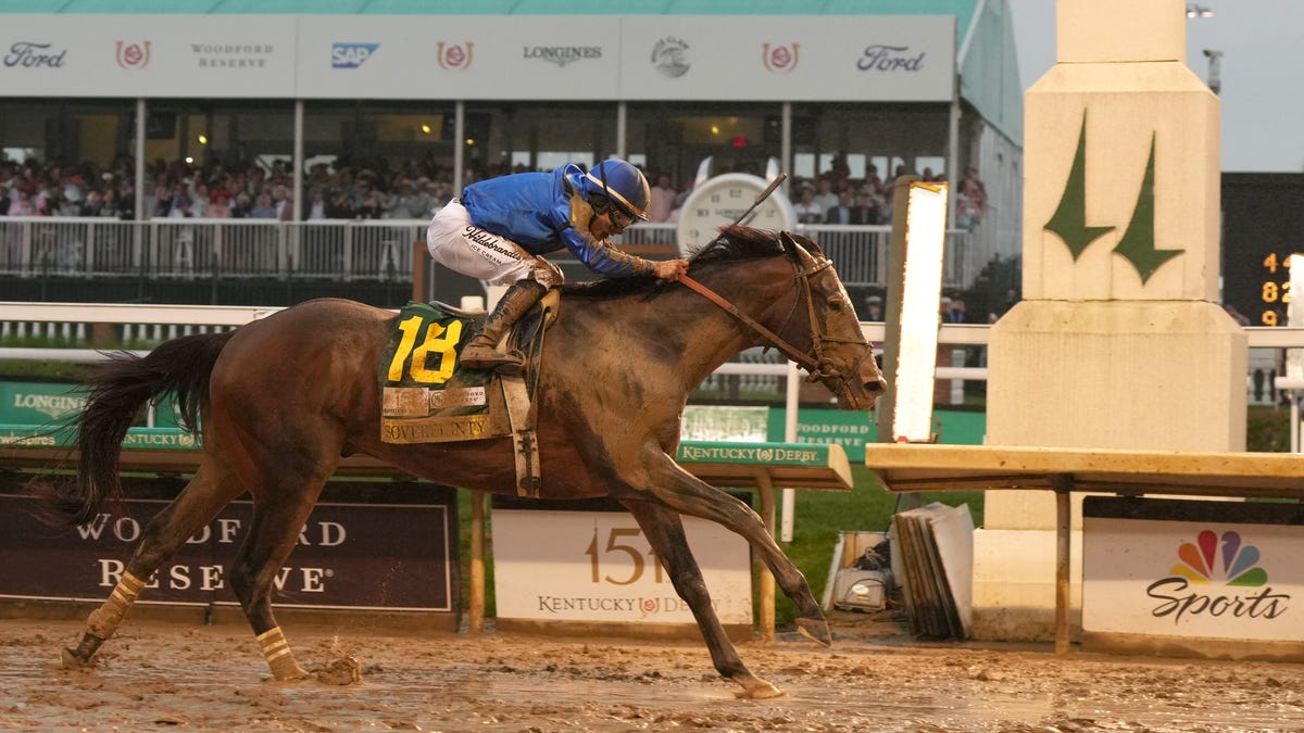 Sovereignty, ridden by jockey Junior Alvarado, crosses the finish line to win the 151st running of the Kentucky Derby.