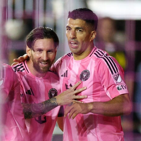 Inter Miami CF forward Luis Suarez (9) celebrates with forward Lionel Messi (10) after scoring a goal against the New York Red Bulls in the first half at Chase Stadium.