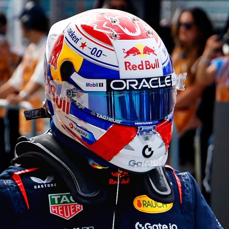 Red Bull driver Max Verstappen celebrates after winning the pole during qualifying for the F1 Miami Grand Prix at Miami International Autodrome.