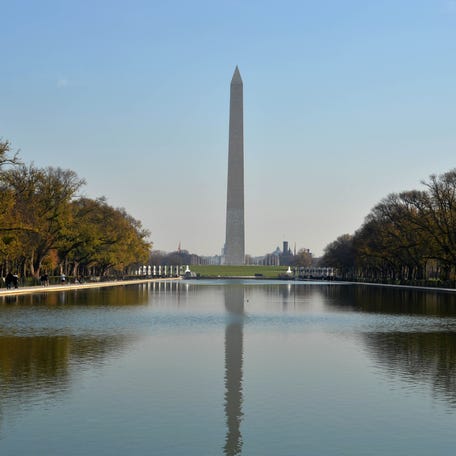 General view of the Washington Monument and reflecting pool at the National Mall. The obelisk was built to commemorate first American president George Washington.