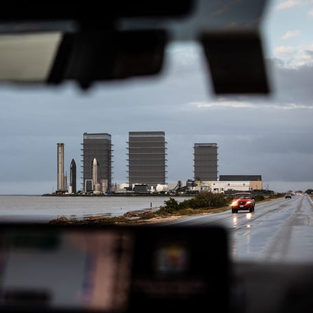 SpaceX Starbase, situated off of State Highway 4, is framed in a windshield on Tuesday, Dec. 3, 2024, in Brownsville, Texas.