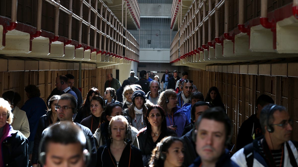 ourists walk through the main cell block at Alcatraz Island on March 21, 2013 in San Francisco, California onthe 50th anniversary of the closure of the notorius Alcatraz federal penitentiary.