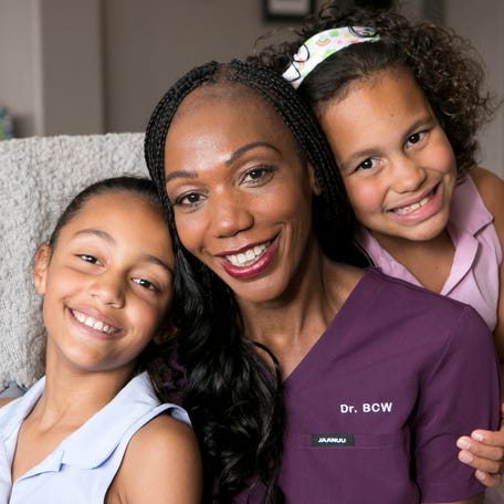 Dr. Bayo Curry-Winchell poses with her two daughters, Jordan Winchell (left) and Jaylin Winchell (right), in 2024.