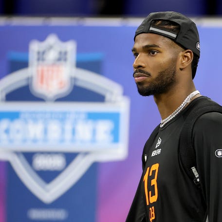 INDIANAPOLIS, INDIANA - MARCH 01: Shedeur Sanders #QB13 of Colorado looks on during the NFL Scouting Combine at Lucas Oil Stadium on March 01, 2025 in Indianapolis, Indiana. (Photo by Stacy Revere/Getty Images)