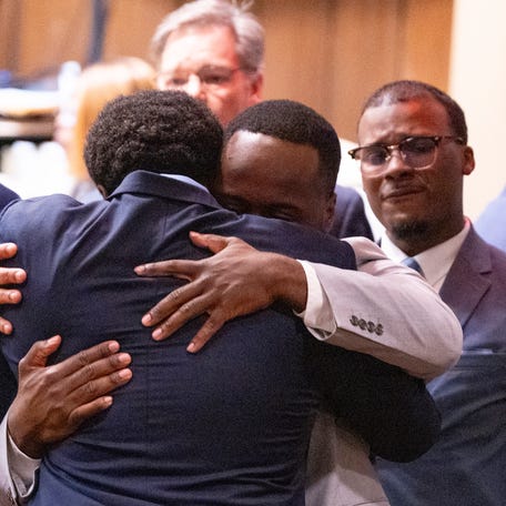 Former Memphis Police Department officers Demetrius Haley and Tadarrius Bean hug as Justin Smith Jr. becomes emotional behind them after they were found not guilty on all charges by the jury on the ninth day of the trial for the death of Tyre Nichols at 201 Poplar in Memphis, Tenn., on Wednesday, May 7, 2025.