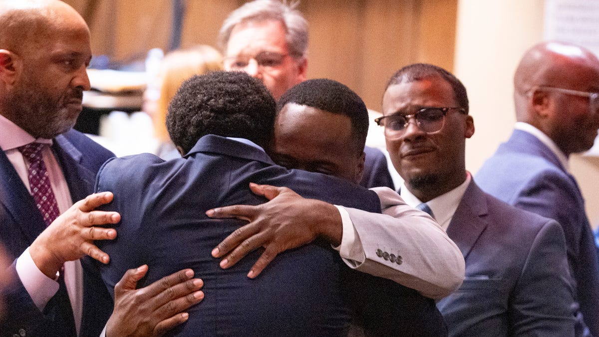 Former Memphis Police Department officers Demetrius Haley and Tadarrius Bean hug as Justin Smith Jr. becomes emotional behind them after they were found not guilty on all charges by the jury on the ninth day of the trial for the death of Tyre Nichols at 201 Poplar in Memphis, Tenn., on Wednesday, May 7, 2025.
