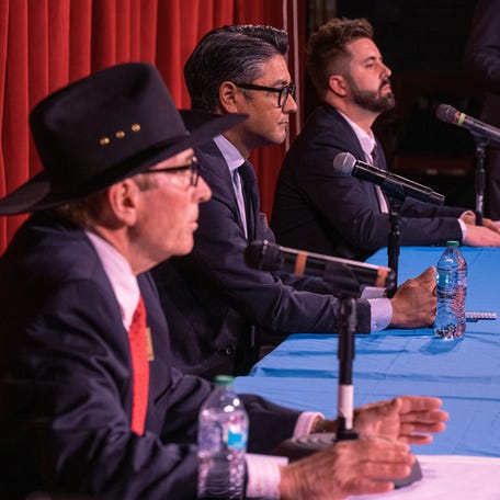 Cincinnati mayoral candidates Brian Frank, left, incumbent Mayor Aftab Pureval and Cory Bowman take the stage during The Cincinnati Enquirer mayoral debate at the Covedale Center for the Arts Tuesday, March 25, 2025.