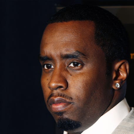 Musician and executive producer Sean "Diddy" Combs arrives for the premiere of the film "Notorious" in New York Jan. 7, 2009.
