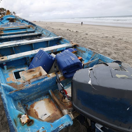 The vessel involved in a deadly Panga boat capsizing off Torrey Pines State Beach sits on the beach after it was dragged from where it came ashore in Del Mar, California, on May 5, 2025.