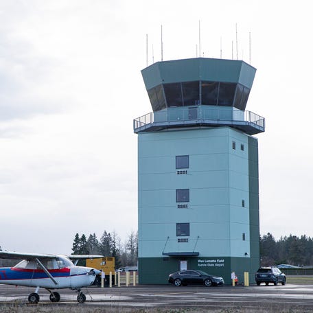 The Aurora State Airport air traffic control tower is seen near the runway on Thursday, Dec. 26, 2024, in Aurora, Ore.