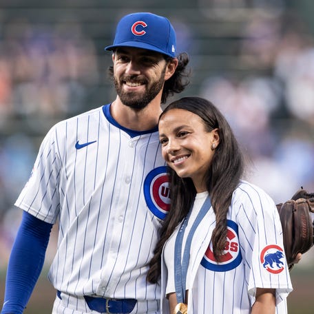 Mallory Swanson of the Chicago Red Stars and Dansby Swanson of the Chicago Cubs pose for a picture before a game between the Chicago Cubs and Oakland Athletics at Wrigley Field on September 17, 2024 in Chicago, Illinois.