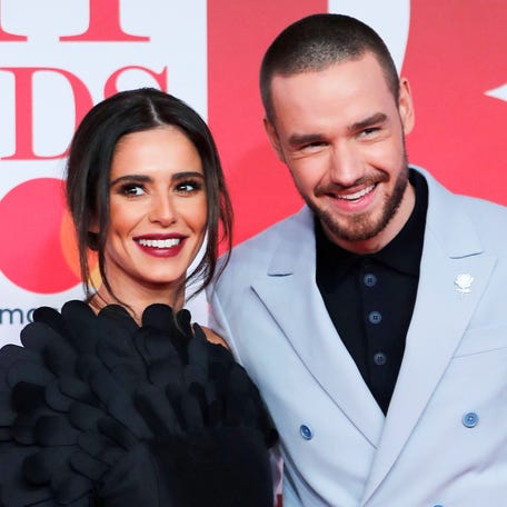 Cheryl, left, and Liam Payne arrive at the Brit Awards at the O2 Arena in London on Feb. 21, 2018.