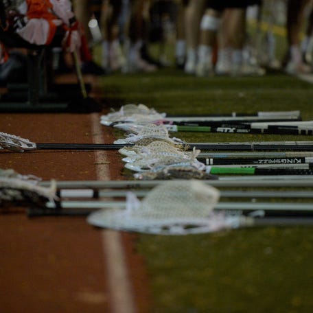 Lacrosse sticks on the ground during a game between the Rocky Mountain boys lacrosse team and 4A No. 2 Erie at French Field on Tuesday, April 23, 2019.