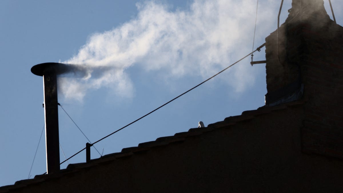 White smoke rises from the chimney on the Sistine Chapel, indicating that a new pope has been elected at the Vatican, May 8, 2025.