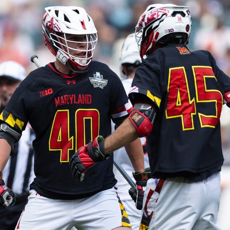 Maryland defender Colin Burlace (40) and attack Daniel Kelly (45) celebrates a goal against Virginia during the semifinals of the 2024 NCAA men's lacrosse tournament at Lincoln Financial.