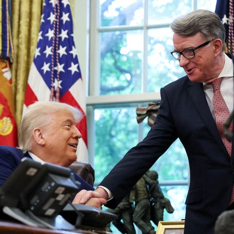U.S. President Donald Trump shakes hands with Britain's ambassador to the United States, Peter Mandelson after announcing a trade deal with the U.K., in the Oval Office at the White House in Washington, D.C., U.S., May 8, 2025. REUTERS/Leah Millis REFILE - CORRECTING NAME AND DESIGNATION FROM " U.S. AMBASSADOR TO THE UNITED KINGDOM WARREN STEPHENS" TO "BRITAIN'S AMBASSADOR TO THE UNITED STATES PETER MANDELSON".