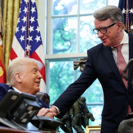 U.S. President Donald Trump shakes hands with Britain's ambassador to the United States, Peter Mandelson, after announcing a trade deal with the U.K., in the Oval Office at the White House in Washington, D.C., U.S., May 8, 2025.