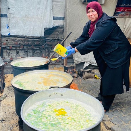Faten Madhoun prepares food at a soup kitchen in northern Gaza in May, 2025. Madhoun is a mother of seven who leads the largest soup kitchen in northern Gaza.