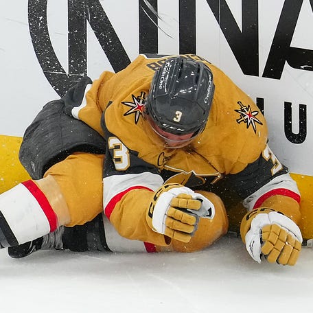Vegas Golden Knights defenseman Brayden McNabb (3) suffers an injury after being tripped into the boards by Edmonton Oilers left wing Viktor Arvidsson (33) during overtime of Game 2.