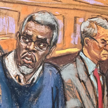 U.S. Marshals sit behind Sean "Diddy" Combs as he sits at the defense table alongside lawyer Brian Steel in the courtroom during his sex trafficking trial in New York City on May 9, 2025.