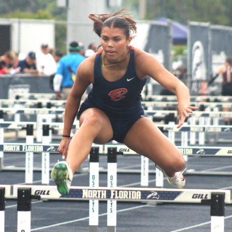 Sam Woods of Benjamin clears a hurdle in the girls 100-meter hurdles during the FHSAA Class 1A high school track and field championships on May 10, 2025. [Clayton Freeman/Florida Times-Union]