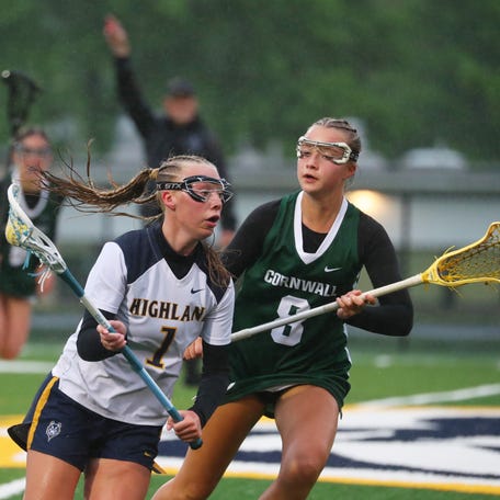 Highland's Quinn Ahrenholtz is covered by Cornwall's Nora Hogan during their game on May 9, 2025.