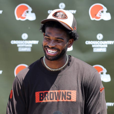 Cleveland Browns quarterback Shedeur Sanders (12) jokes about his signing bonus during a press conference before day two of NFL rookie minicamp at the Cleveland Browns training facility on Saturday, May 10, 2025, in Berea, Ohio.