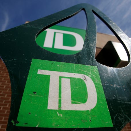 Toronto-Dominion Bank (TD) logos are seen outside of a branch in Ottawa, Ontario, Canada, May 26, 2016.