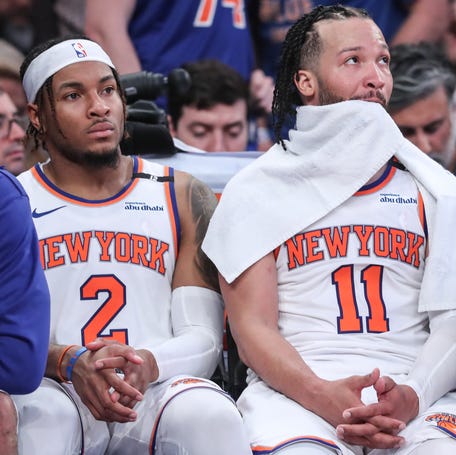 New York Knicks guards Miles McBride (2) and Jalen Brunson (11) sit on the bench in the fourth quarter of Game 3.