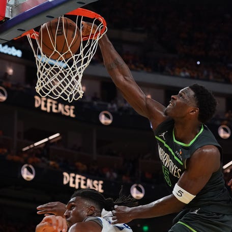 Anthony Edwards dunks over Kevon Looney in the third quarter of Game 3. Edwards exploded for 36 points.