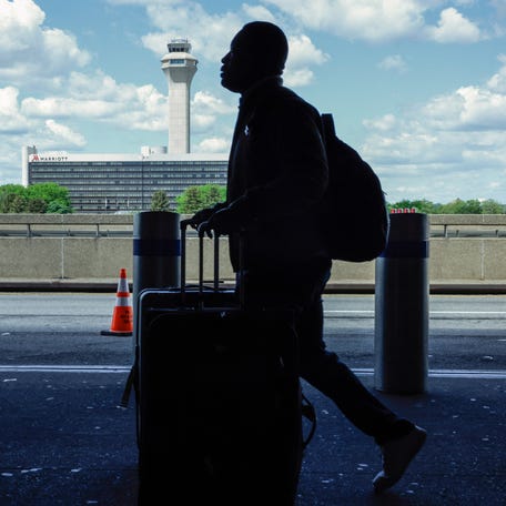 The FAA Air Traffic Control tower is seen at Newark Liberty International Airport in Newark, New Jersey on May 7, 2025. Regulators have been slowing arrivals and departures at one of the United States' busiest airports following a 90-second traffic control system outage last week that has industry experts sounding alarm bells. Photo by KENA BETANCUR/AFP via Getty Images)