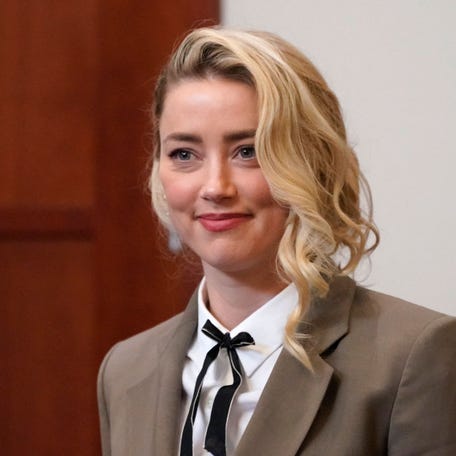 Amber Heard arrives into the courtroom after a break at the Fairfax County Circuit Courthouse in Fairfax, Virginia, on May 23, 2022.