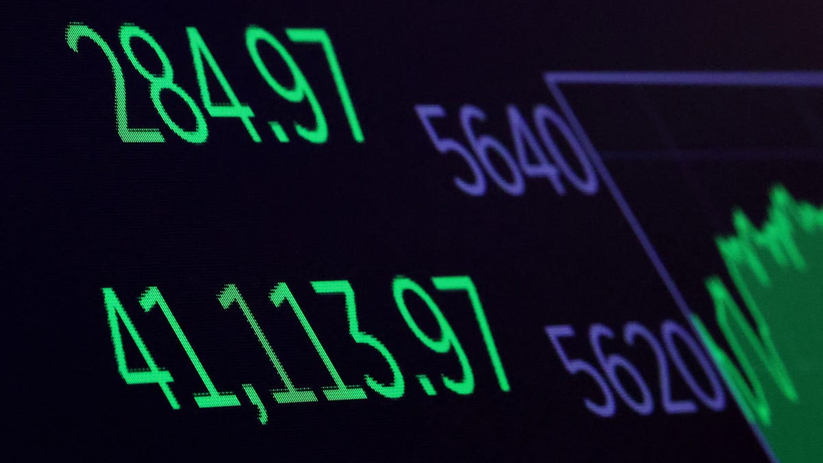 A screen displays the Dow Jones Industrial Average after the closing bell on the floor at the New York Stock Exchange (NYSE) in New York City, U.S., May 7, 2025. REUTERS/Brendan McDermid