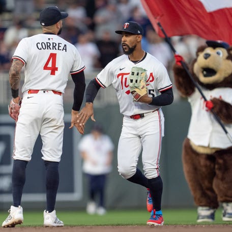 Carlos Correa and Byron Buxton celebrate a win over the Giants.