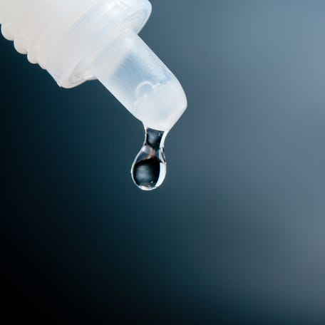 Close-Up Of Liquid Dropping From Pipette