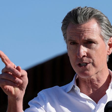 California Governor Gavin Newsom speaks on transnational commerce and border security while visiting the U.S.- Mexico border in San Diego, California on Dec. 5, 2024.