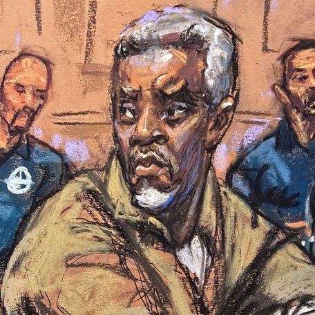 Sean "Diddy" Combs sits with members of his defense team for a conference ahead of his trial on sex-trafficking charges, in New York City, April 18, 2025, in this courtroom sketch.