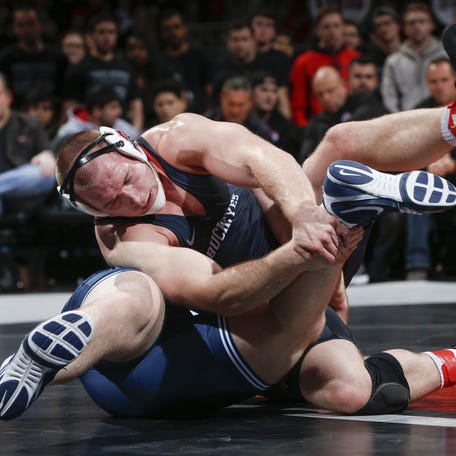 Ohio State Buckeyes wrestler Kyle Snyder, left, wrestles with Penn State Nittany Lions wrestler Nick Nevills, right, during the heavyweight match of a NCAA wrestling dual match between the Ohio State Buckeyes and the Penn State Nittany Lions on Friday, February 3, 2017 at Value City Arena in Columbus, Ohio.