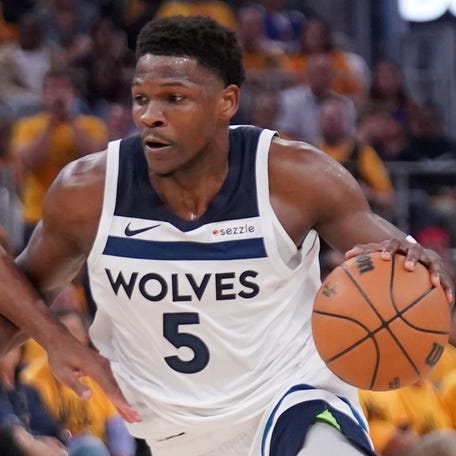 Anthony Edwards drives past Buddy Hield during Game 4 at Chase Center. Edwards finished with 30 points in 33 minutes.