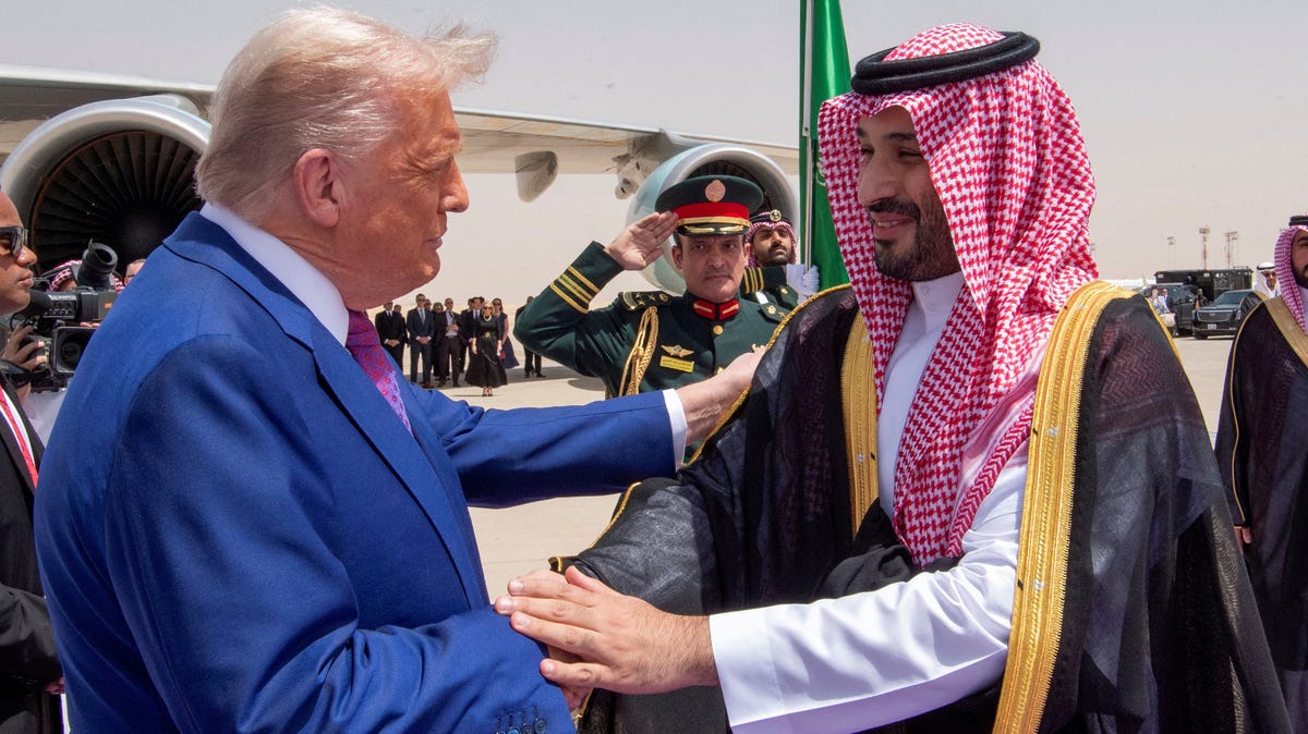 President Donald Trump, left, shakes hands with Saudi Crown Prince Mohammed Bin Salman during a welcoming ceremony in Riyadh, Saudi Arabia, on May 13, 2025.
