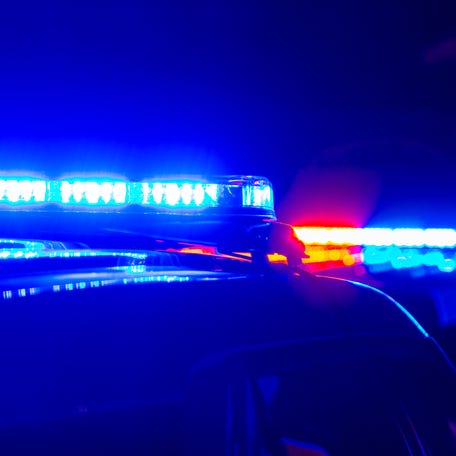 Blue and red police lights at a generic crime scene.