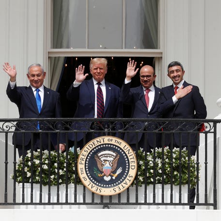 Israel's Prime Minister Benjamin Netanyahu, U.S. President Donald Trump, Bahrain's Foreign Minister Abdullatif Al Zayani and United Arab Emirates Foreign Minister Abdullah bin Zayed wave from the White House balcony after a signing ceremony for the Abraham Accords on the South Lawn of the White House September 15, 2020.