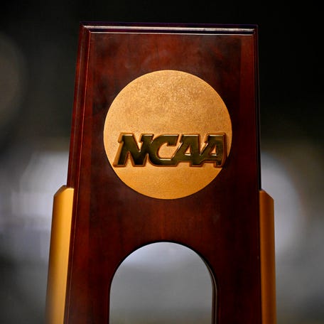 A view of the NCAA logo and trophy before the 2025 Women's National Gymnastics Championship at Dickies Arena.