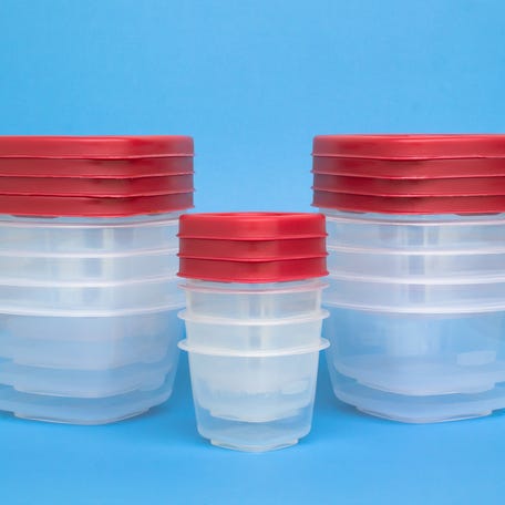 Food preservation containers with red lids on blue.