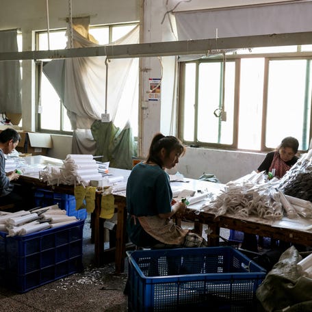 Employees pack Halloween-themed toys at the factory of Xubo, a Halloween decorations manufacturer, in Yiwu, Zhejiang province, China May 14, 2025.