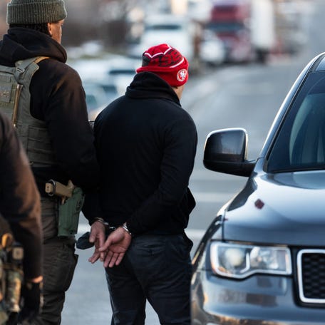 Immigration and Customs Enforcement (ICE) agents apprehend an immigrant from El Salvador after surveilling him for days, in Herndon, Virginia, on Jan. 15, 2025. The man had a criminal conviction and was in the country illegally.