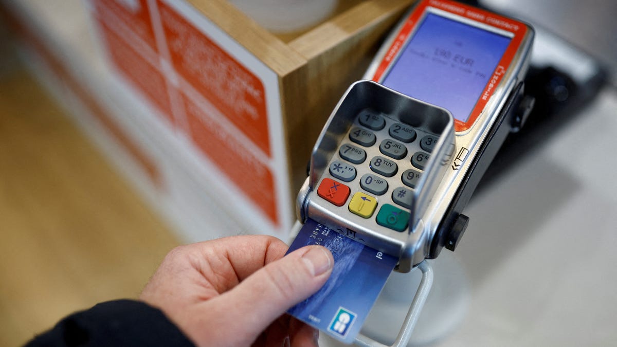A credit card is used on a payment terminal at a shop near Nantes, France, in this illustration picture taken November 6, 2023.