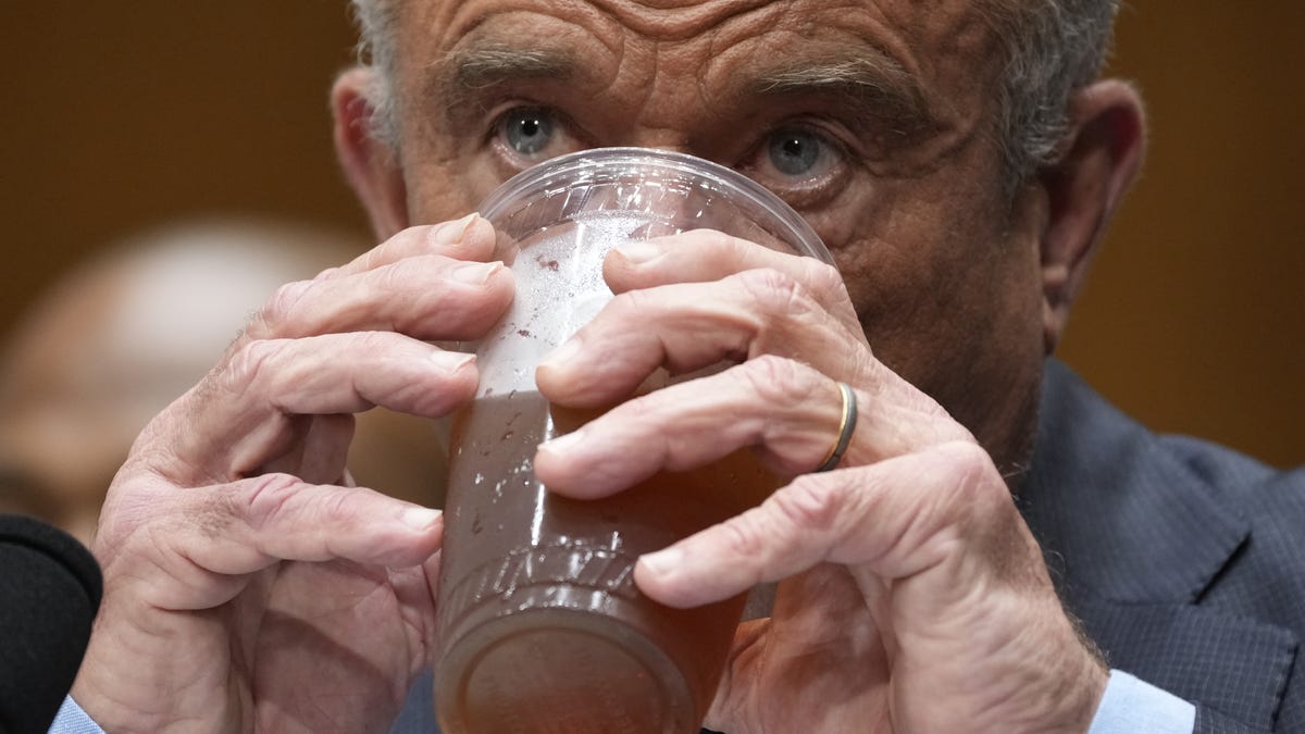 Robert F. Kennedy, Jr., Secretary of the Department of Health and Human Services, drinks a beverage while he testifies in front of the Senate Health, Education, Labor, and Pensions Committee in Washington, D.C., on May 15, 2025.